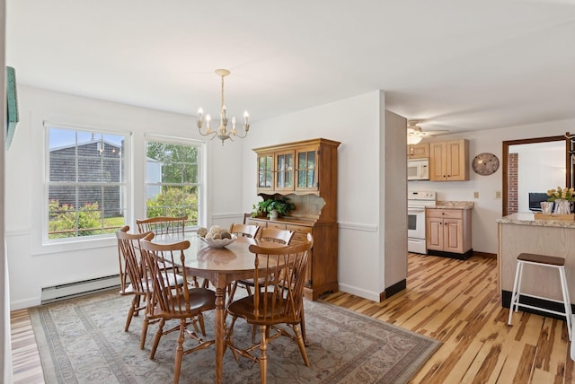 16 Marsh View Ave, Kennebunk, ME 04043 - dining room with a baseboard heating unit, light wood-style flooring, a chandelier, baseboards, and a ceiling fan