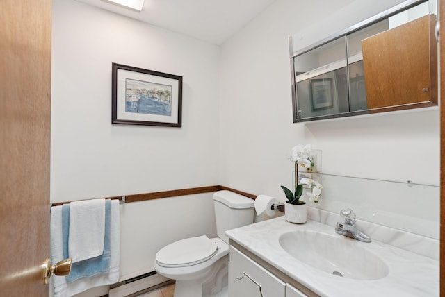 16 Marsh View Ave, Kennebunk, ME 04043 - bathroom with a baseboard heating unit, toilet, and vanity