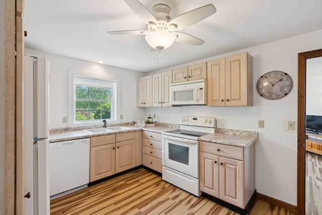 16 Marsh View Ave, Kennebunk, ME 04043 - kitchen featuring white appliances, light brown cabinets, a sink, light countertops, and light wood-style flooring