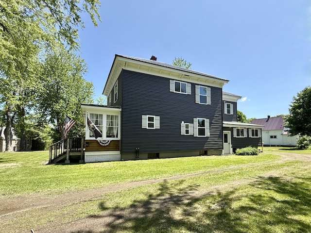 88 Union St, Calais, ME 04619 - rear view of property with a yard and a chimney