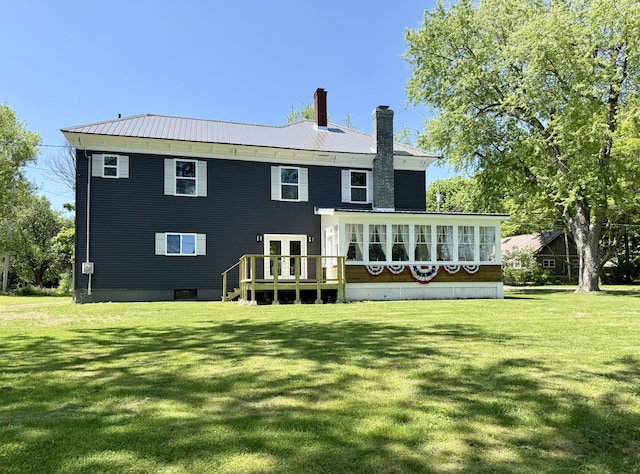 88 Union St, Calais, ME 04619 - back of house with a chimney, a yard, french doors, and a deck