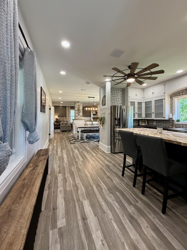 88 Union St, Calais, ME 04619 - dining area with baseboards, wood finished floors, recessed lighting, and a ceiling fan