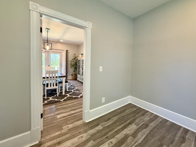 88 Union St, Calais, ME 04619 - empty room with dark wood finished floors and baseboards