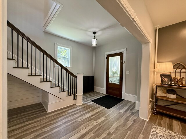88 Union St, Calais, ME 04619 - foyer with wood finished floors, stairs, and baseboards
