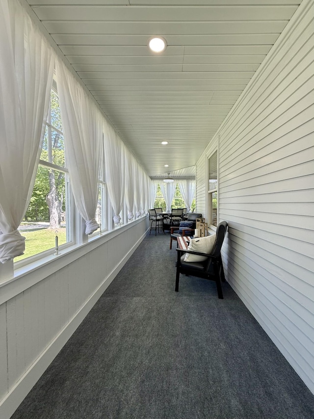 88 Union St, Calais, ME 04619 - sunroom featuring carpet, wood walls, and recessed lighting