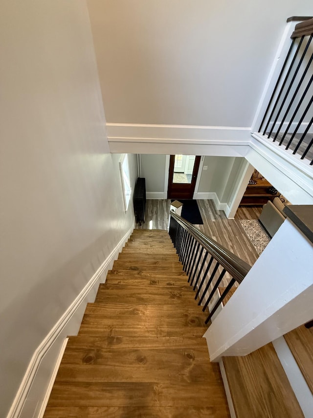 88 Union St, Calais, ME 04619 - stairs featuring wood finished floors and baseboards