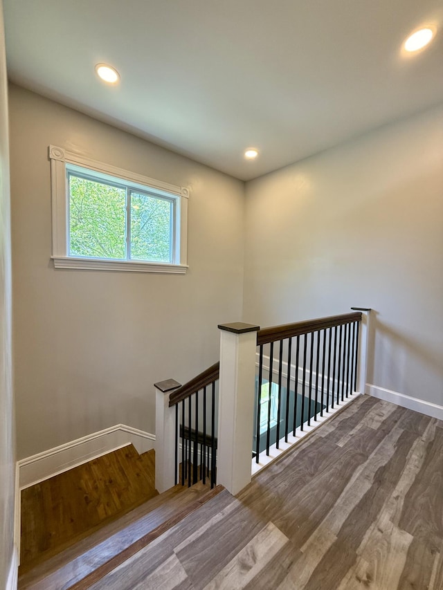88 Union St, Calais, ME 04619 - stairs with wood finished floors, baseboards, and recessed lighting