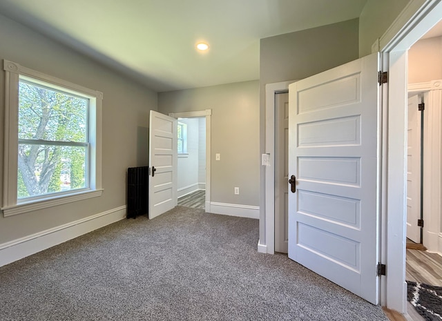 88 Union St, Calais, ME 04619 - unfurnished bedroom featuring carpet floors, baseboards, and recessed lighting