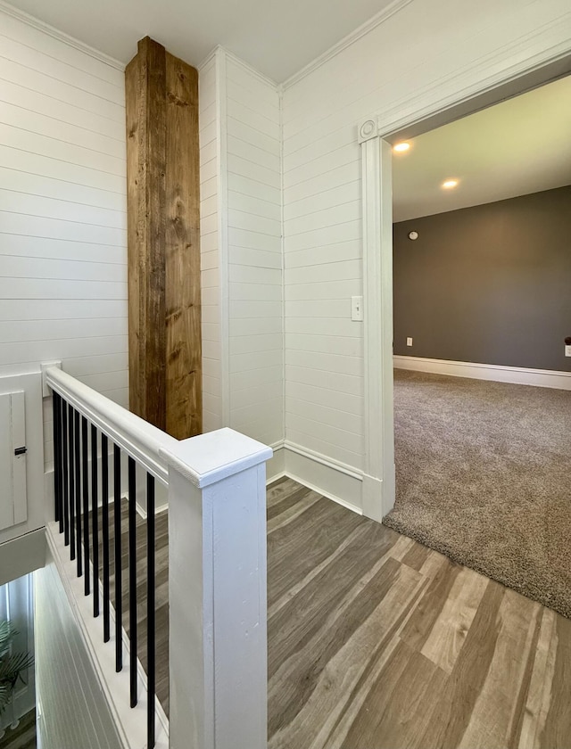 88 Union St, Calais, ME 04619 - corridor with an upstairs landing, wood finished floors, wooden walls, ornamental molding, and baseboards