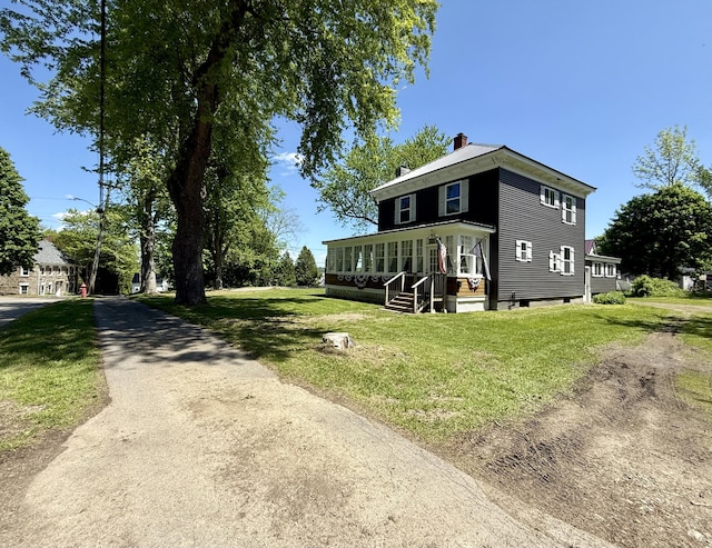 88 Union St, Calais, ME 04619 - view of front facade featuring a front lawn and a chimney