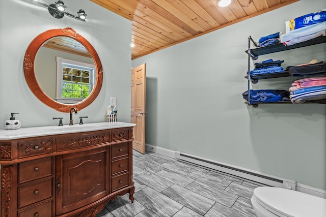 55 Mountain View Ext, Rockland, ME 04841 - bathroom featuring wood ceiling, baseboard heating, vanity, toilet, and crown molding
