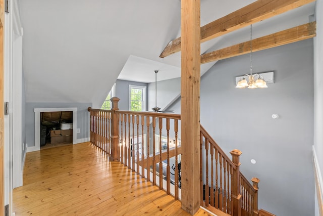 55 Mountain View Ext, Rockland, ME 04841 - hall with wood-type flooring, a chandelier, an upstairs landing, and baseboards