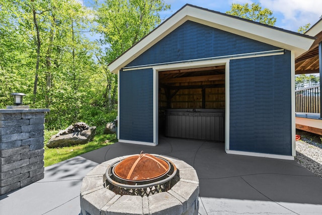 55 Mountain View Ext, Rockland, ME 04841 - view of patio featuring an outdoor fire pit and an outbuilding