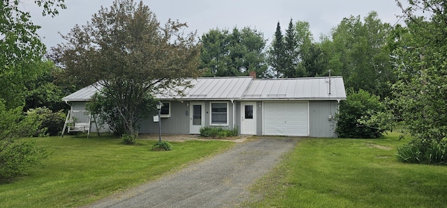 20 Oosoola St, Norridgewock, ME 04957 - ranch-style house featuring an attached garage, asphalt driveway, a front lawn, and a chimney