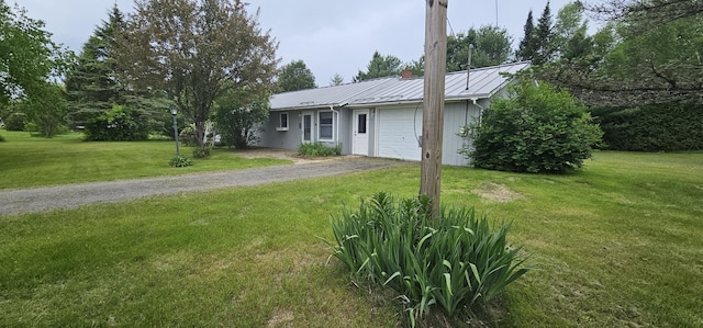 20 Oosoola St, Norridgewock, ME 04957 - ranch-style house with a garage, driveway, metal roof, and a front yard