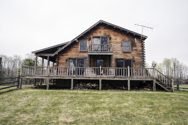 526 Range Rd, Dover-Foxcroft, ME 04426 - back of property featuring a balcony, log exterior, and a deck