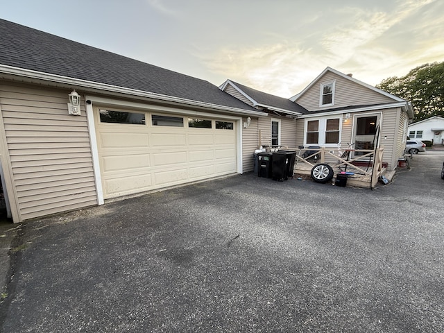43 Rosedale St, Lewiston, ME 04240 - view of front of house with driveway, an attached garage, and roof with shingles