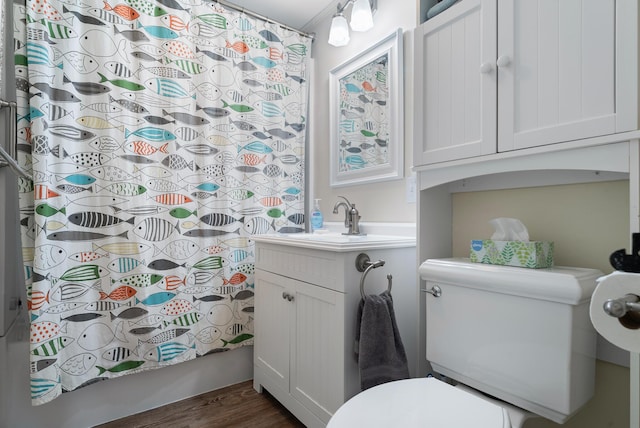 14 Larrys Ldg Unit 14, Ogunquit, ME 03907 - bathroom featuring toilet, vanity, shower / tub combo, and wood finished floors