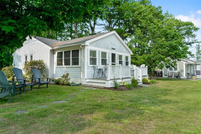 14 Larrys Ldg Unit 14, Ogunquit, ME 03907 - view of front of property with a front yard and a wooden deck