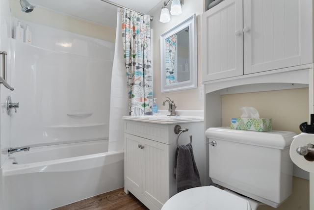 14 Larrys Ldg Unit 14, Ogunquit, ME 03907 - bathroom featuring toilet, shower / bath combo with shower curtain, vanity, and wood finished floors