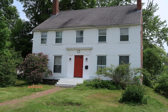 7 Elm St, Augusta, ME 04330 - colonial-style house with a chimney, a front lawn, and a shingled roof