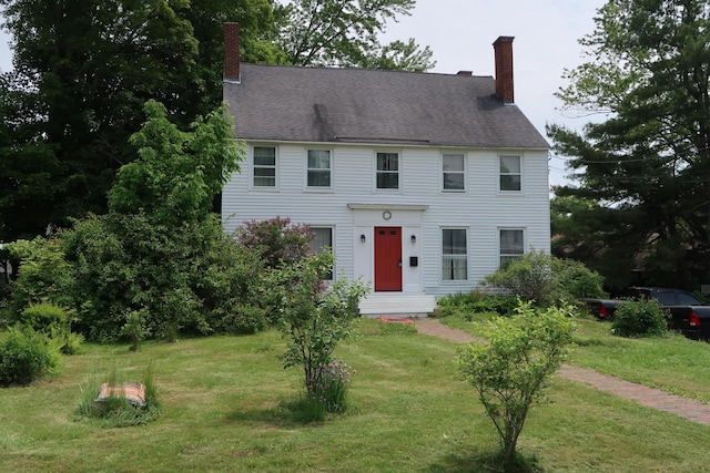 7 Elm St, Augusta, ME 04330 - colonial home with a chimney and a front lawn