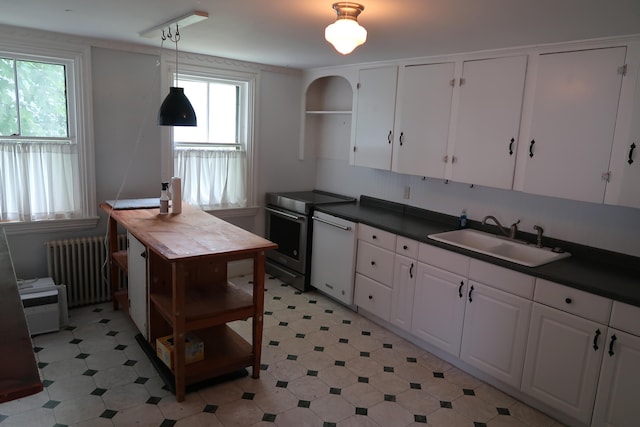 7 Elm St, Augusta, ME 04330 - kitchen featuring radiator heating unit, a sink, stainless steel electric range, and dark countertops