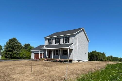 144 Curtis St, Pittsfield, ME 04967 - view of front of house featuring a porch and a garage