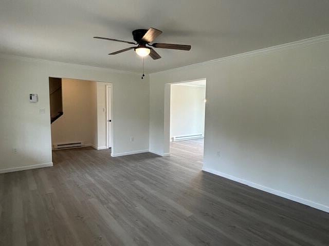144 Curtis St, Pittsfield, ME 04967 - spare room featuring a ceiling fan, ornamental molding, a baseboard radiator, dark wood-style flooring, and baseboards