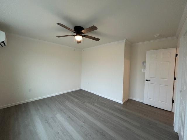 144 Curtis St, Pittsfield, ME 04967 - empty room featuring ceiling fan, dark wood-style floors, baseboards, and crown molding