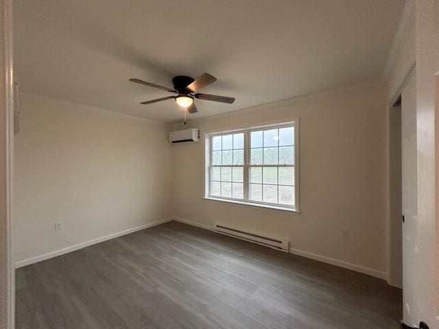 144 Curtis St, Pittsfield, ME 04967 - unfurnished room featuring baseboard heating, an AC wall unit, dark wood-style flooring, a ceiling fan, and baseboards