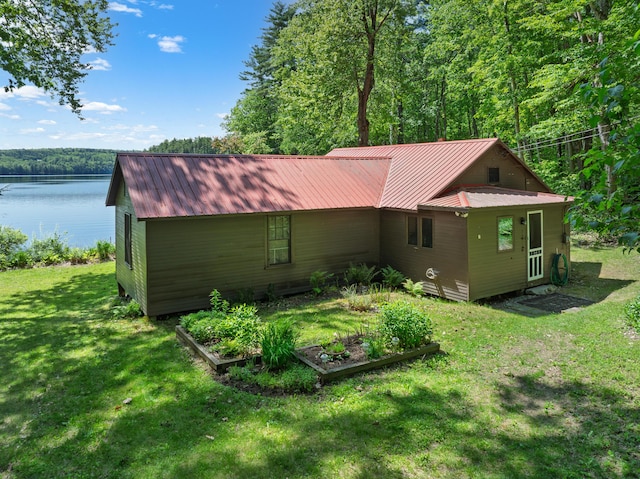 66 Myron Hall Rd, Raymond, ME 04071 - view of side of home with a vegetable garden, a lawn, a water view, a forest view, and metal roof