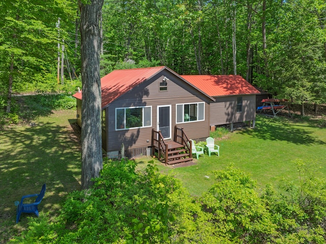 66 Myron Hall Rd, Raymond, ME 04071 - chalet / cabin with metal roof, a front yard, and a forest view