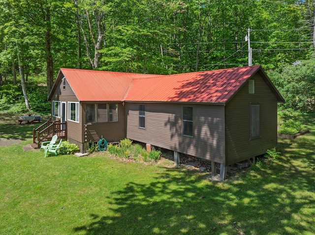 66 Myron Hall Rd, Raymond, ME 04071 - view of front of property featuring a front lawn, metal roof, and a wooded view