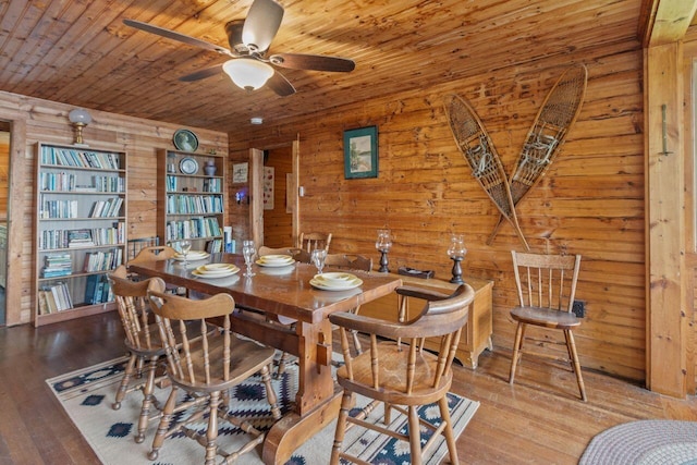 66 Myron Hall Rd, Raymond, ME 04071 - dining room featuring wood walls, ceiling fan, wooden ceiling, and wood-type flooring