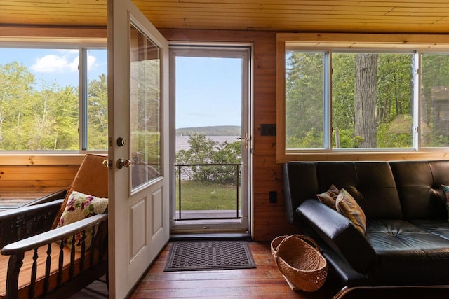 66 Myron Hall Rd, Raymond, ME 04071 - doorway with healthy amount of natural light, hardwood / wood-style flooring, wooden ceiling, and wooden walls