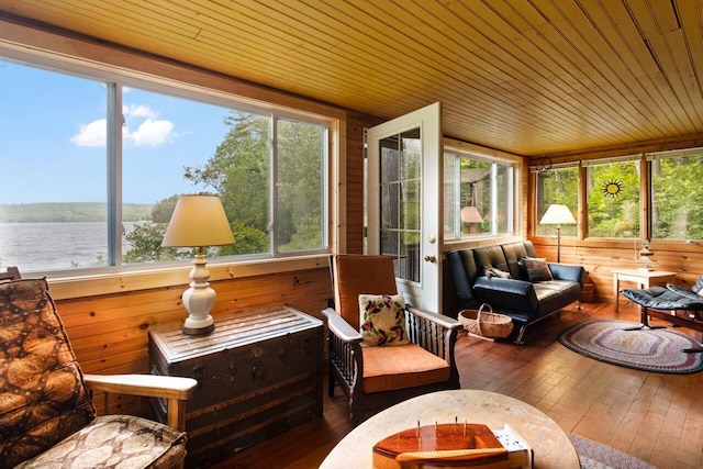 66 Myron Hall Rd, Raymond, ME 04071 - sunroom / solarium with hardwood / wood-style flooring, wooden ceiling, wooden walls, an outdoor living space, and a deck with water view