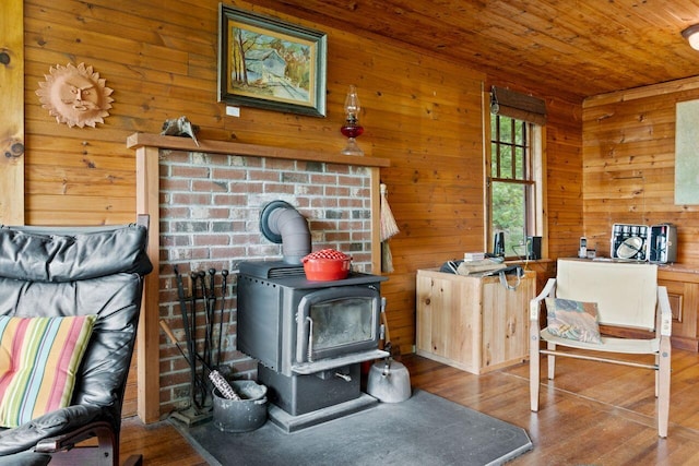 66 Myron Hall Rd, Raymond, ME 04071 - detailed view of a wood stove, wood finished floors, wood walls, and wood ceiling