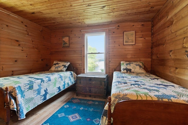 66 Myron Hall Rd, Raymond, ME 04071 - bedroom featuring wooden ceiling, wood finished floors, and wood walls