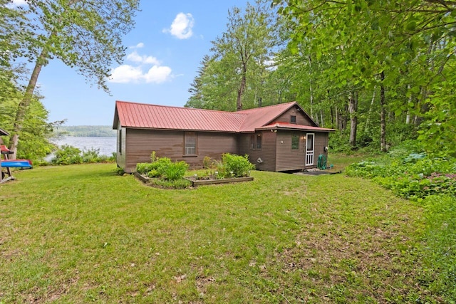 66 Myron Hall Rd, Raymond, ME 04071 - rear view of property featuring a water view, a yard, and metal roof
