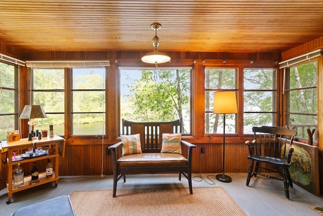 66 Myron Hall Rd, Raymond, ME 04071 - sunroom with wood ceiling, plenty of natural light, wood walls, and hardwood / wood-style floors