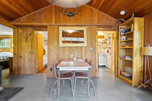 66 Myron Hall Rd, Raymond, ME 04071 - dining room featuring vaulted ceiling, wooden walls, wooden ceiling, hardwood / wood-style flooring, and a baseboard heating unit