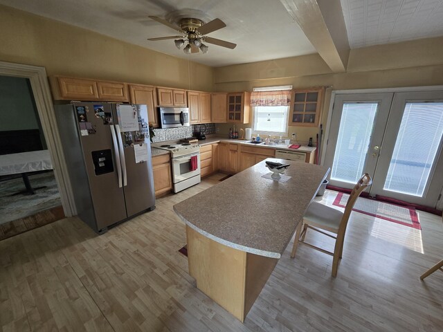 25 Jarvis Gore Dr, Eddington, ME 04428 - kitchen featuring stainless steel appliances, light brown cabinets, ceiling fan, light wood-style floors, and beamed ceiling
