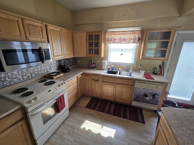 25 Jarvis Gore Dr, Eddington, ME 04428 - kitchen featuring white appliances, a sink, glass insert cabinets, light brown cabinets, and decorative backsplash