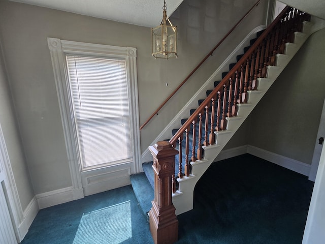 25 Jarvis Gore Dr, Eddington, ME 04428 - stairs featuring a chandelier, carpet floors, healthy amount of natural light, and baseboards