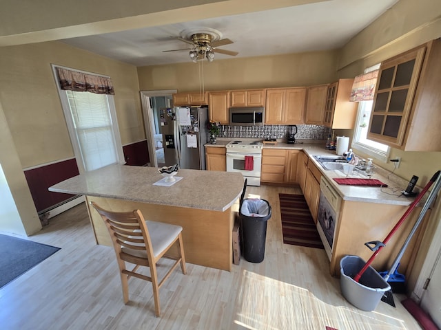 25 Jarvis Gore Dr, Eddington, ME 04428 - kitchen featuring white appliances, light brown cabinets, light wood-style floors, a ceiling fan, and light countertops