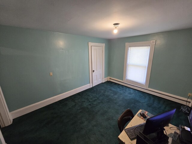 25 Jarvis Gore Dr, Eddington, ME 04428 - empty room featuring baseboard heating, dark colored carpet, baseboards, and an office area