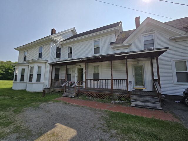 25 Jarvis Gore Dr, Eddington, ME 04428 - multi unit property featuring a chimney and a porch