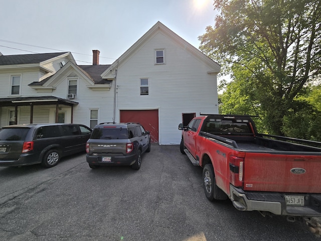 25 Jarvis Gore Dr, Eddington, ME 04428 - view of property exterior featuring a garage and asphalt driveway