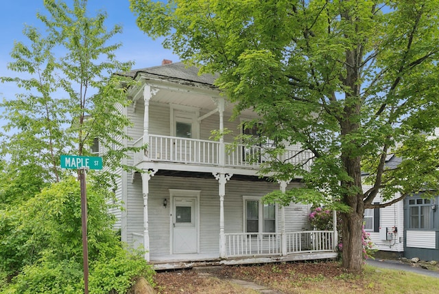 9 Maple St, Jay, ME 04239 - view of front facade featuring a balcony, a porch, and a chimney